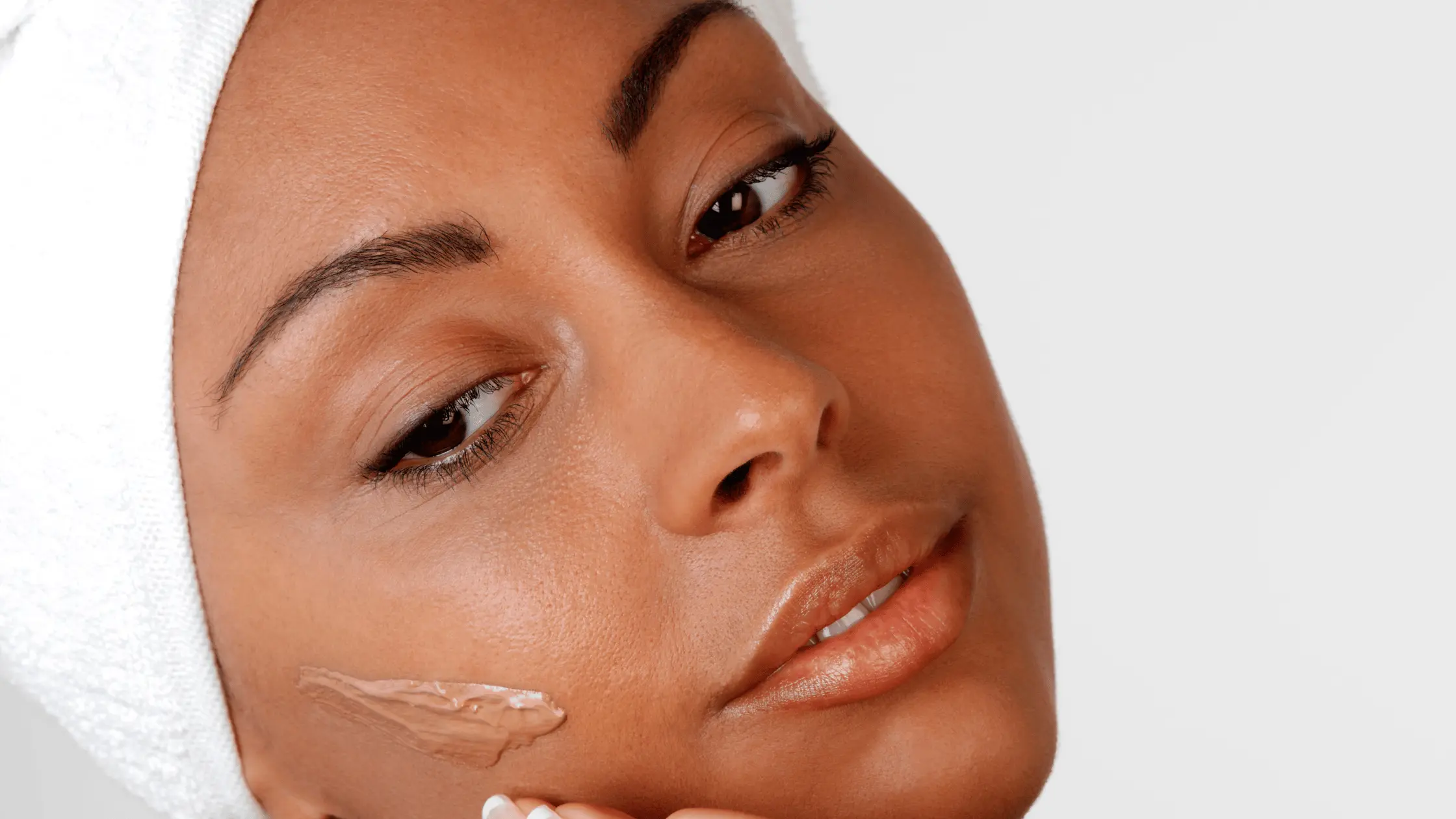 Black Woman Applying Foundation